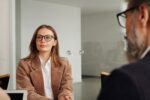 Professionals collaborating on business process documentation in an office