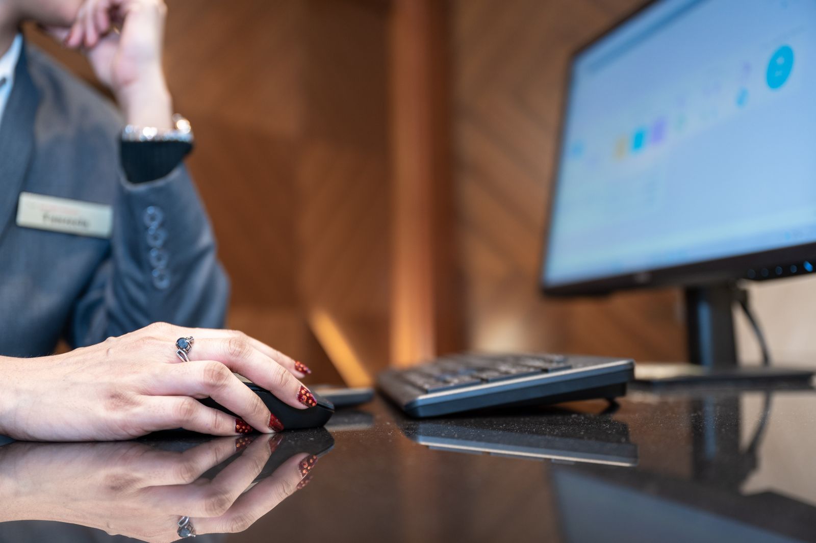 Corporate professional using computer in a modern office environment