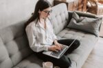 Person working remotely from home on a laptop
