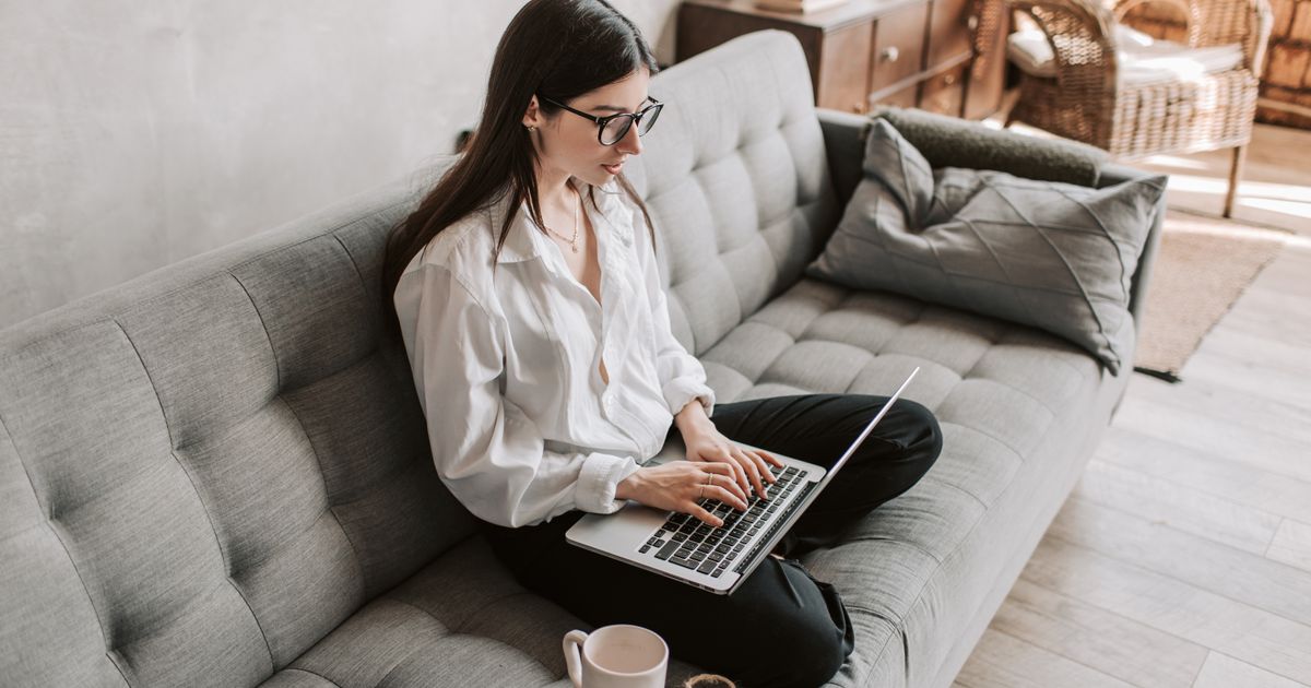 Person working remotely from home on a laptop