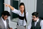 Tense meeting in an office representing a difficult manager situation at work