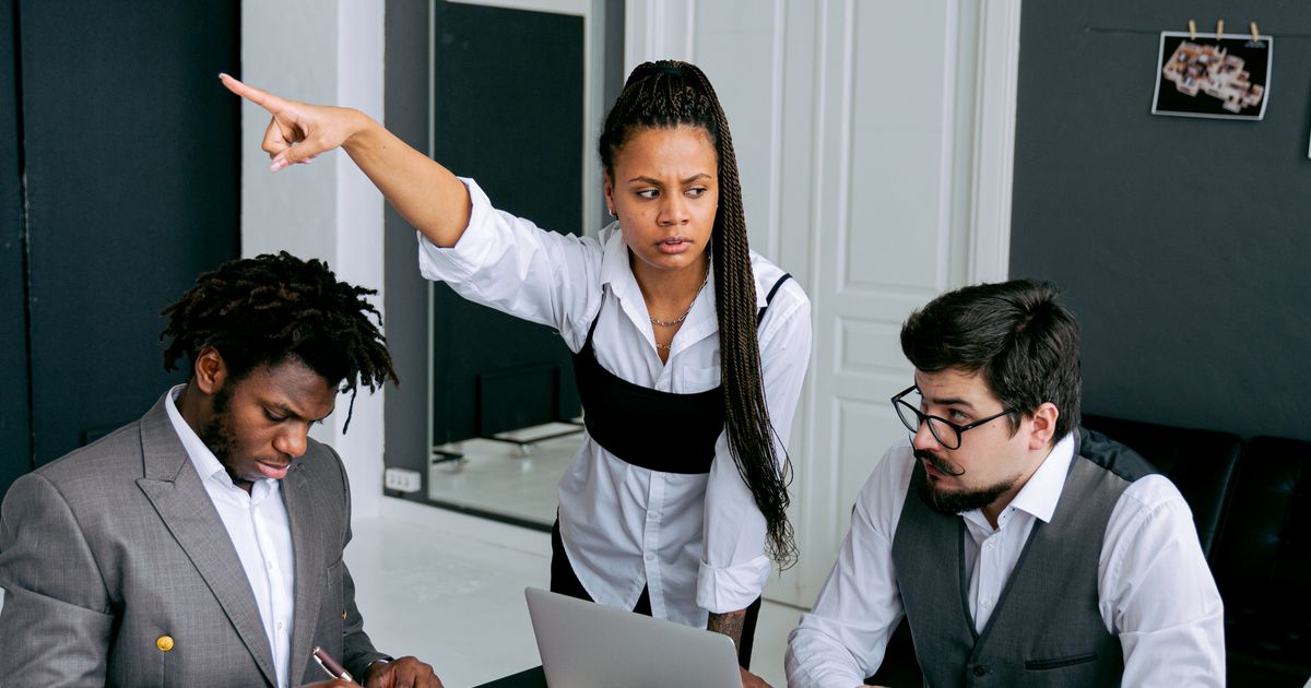 Tense meeting in an office representing a difficult manager situation at work