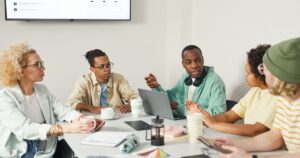 Candidates participating in a group discussion interview round