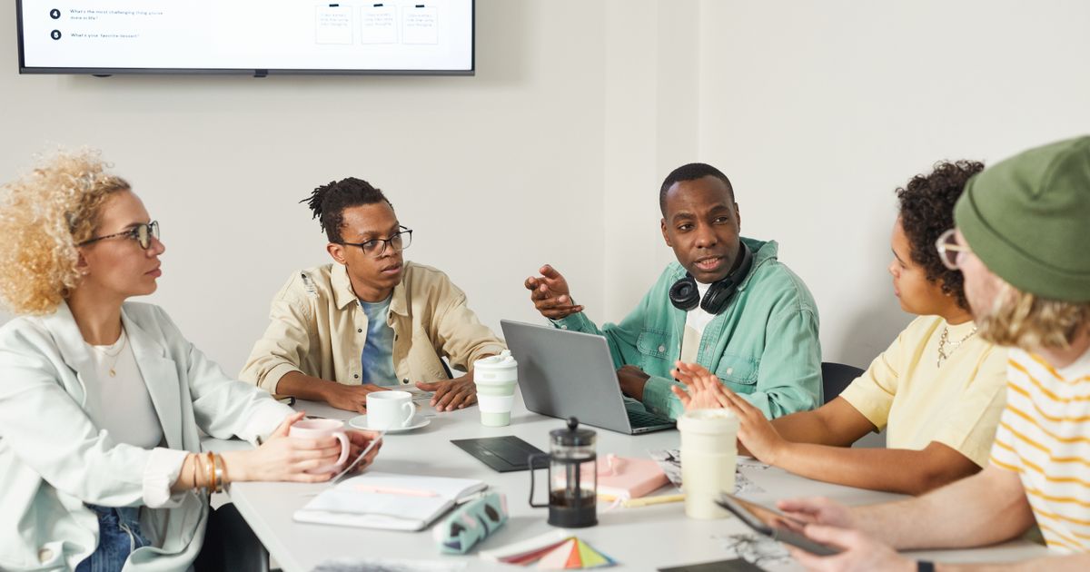Candidates participating in a group discussion interview round