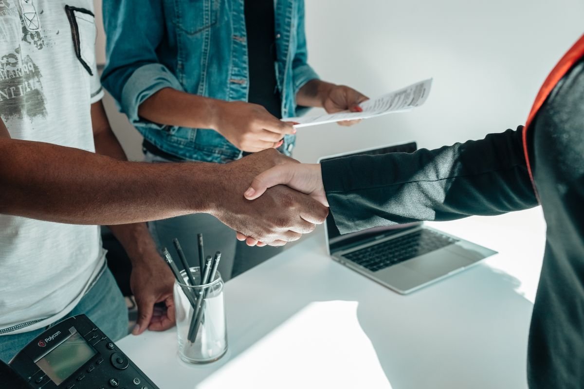 Colleagues agreeing on a job offer with a handshake