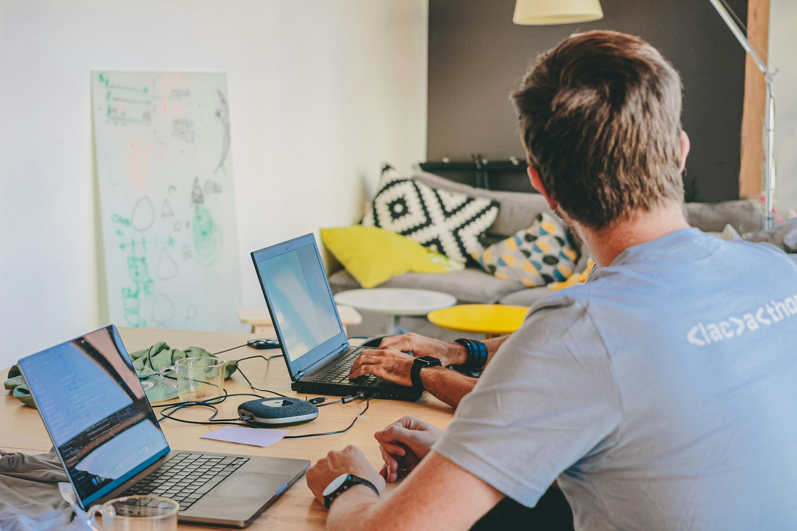 Software engineer associate working on laptop in a modern India tech office